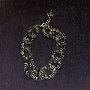 Chunky gold chain necklace with black detailing